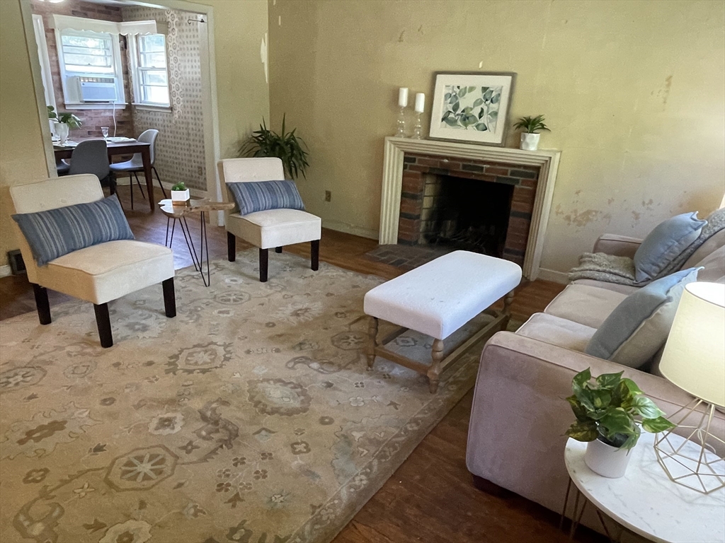 5 Brookfield Road Andover, MA 01810 - Photo 7 of 17 a living room with furniture and a fireplace
