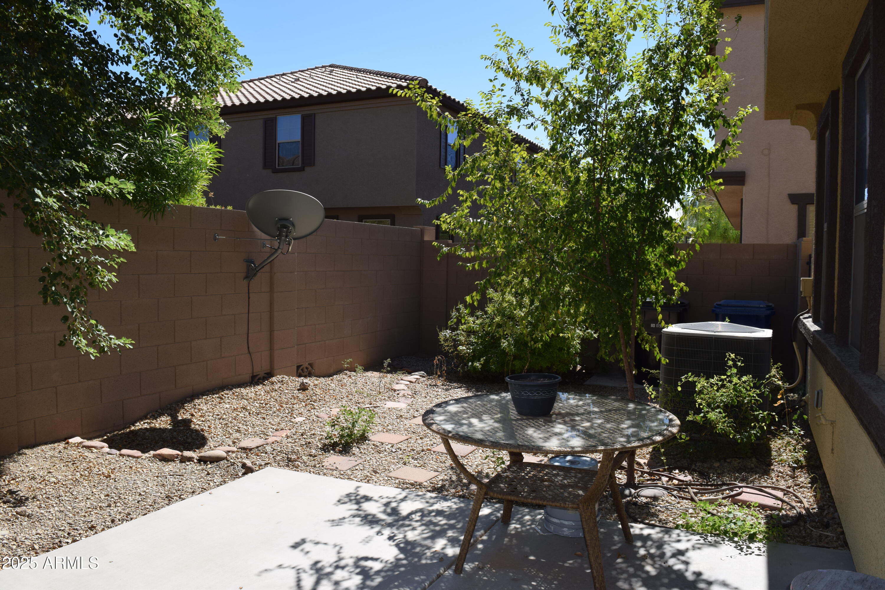 1250 South Rialto, Unit 24 Mesa, AZ 85209 - Photo 22 of 25 a backyard of a house with outdoor seating