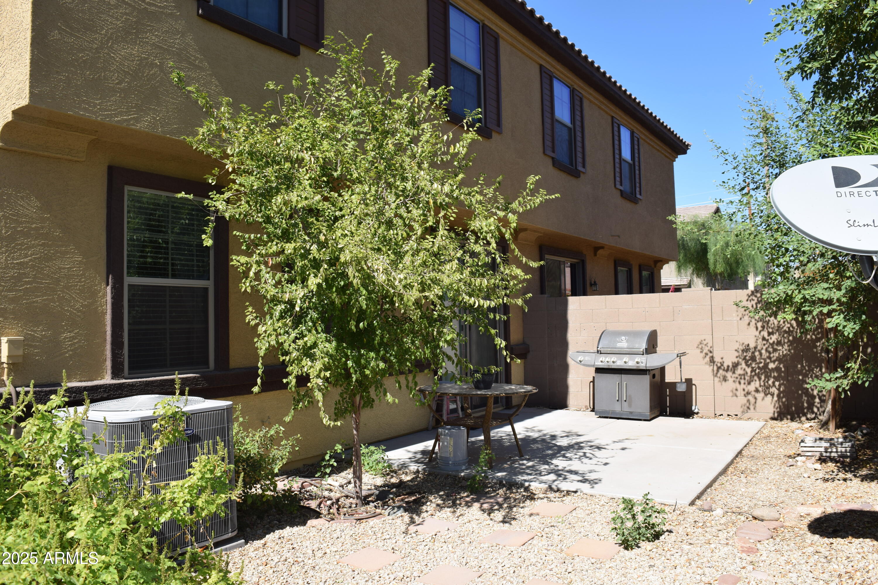 1250 South Rialto, Unit 24 Mesa, AZ 85209 - Photo 23 of 25 a backyard of a house with yard and outdoor seating