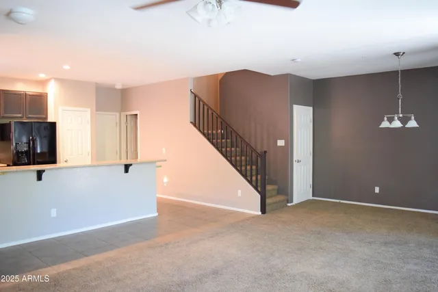 a view of an empty room with stairs