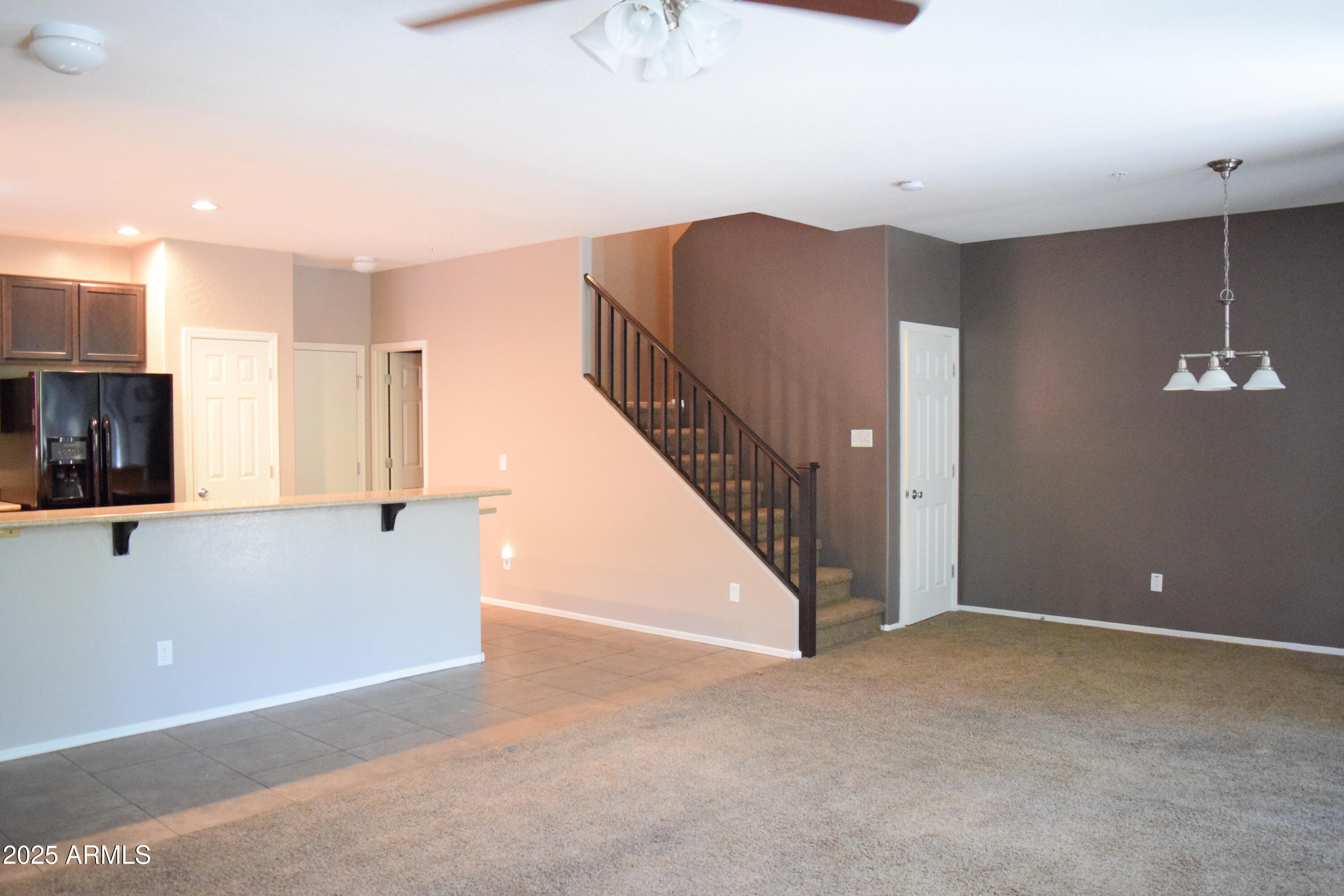 1250 South Rialto, Unit 24 Mesa, AZ 85209 - Photo 5 of 25 a view of an empty room with stairs