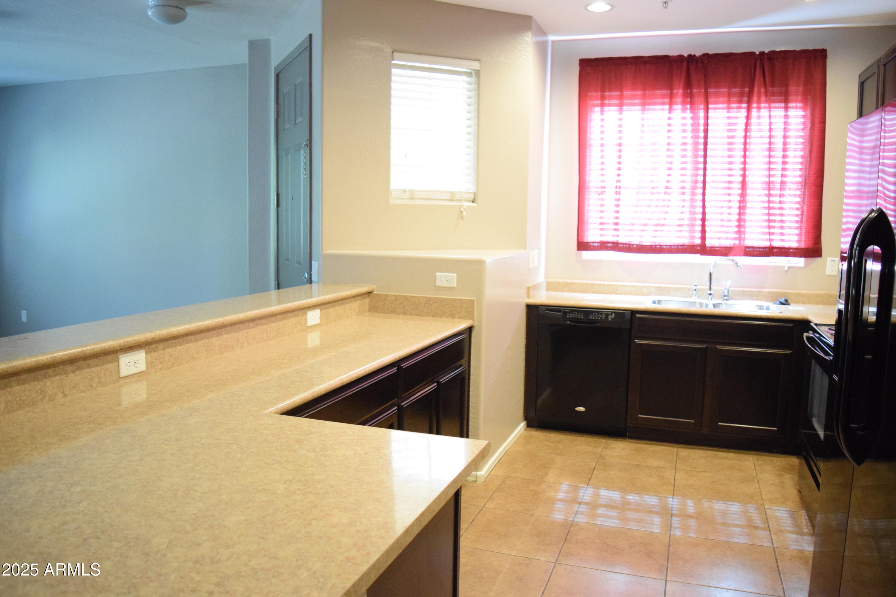 1250 South Rialto, Unit 24 Mesa, AZ 85209 - Photo 7 of 25 a kitchen with a stove and a refrigerator