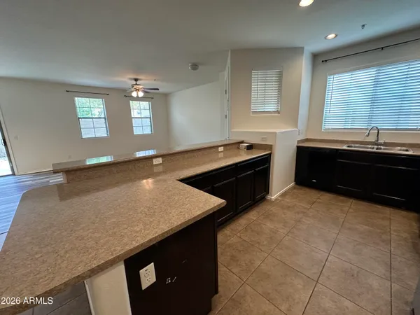 a kitchen with stainless steel appliances granite countertop a refrigerator sink and cabinets