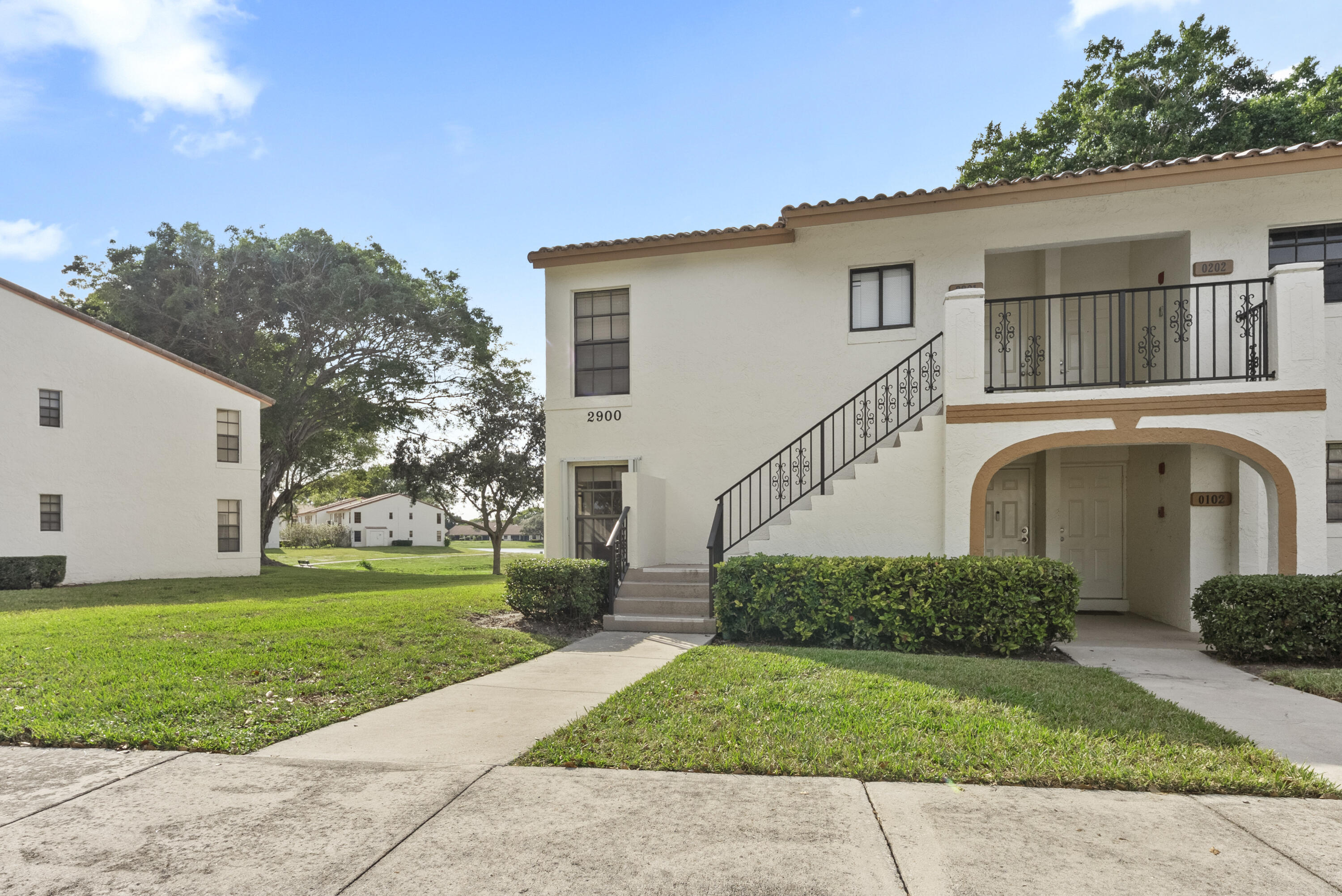 2900 Olivewood Terrace, Unit 2010 Boca Raton, FL 33431 - Photo 18 of 22 a view of a house with a garden