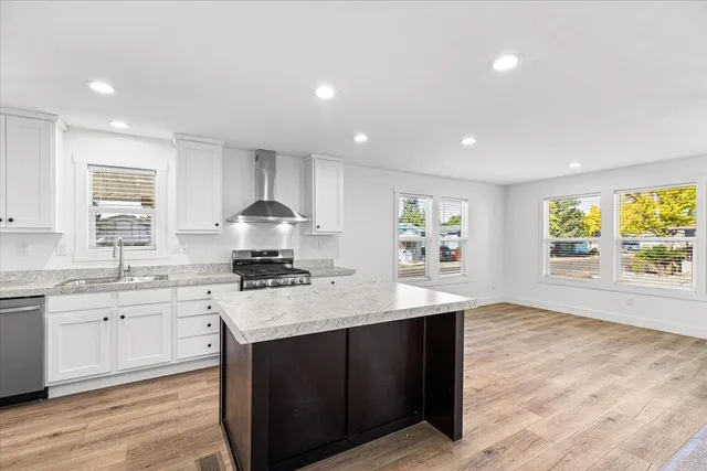 a kitchen with a sink stove and cabinets