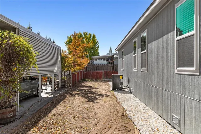 a view of a backyard with sitting area