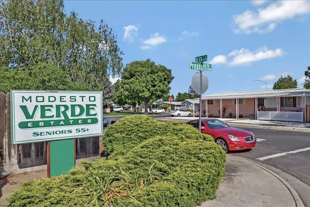 a front view of a building with parking
