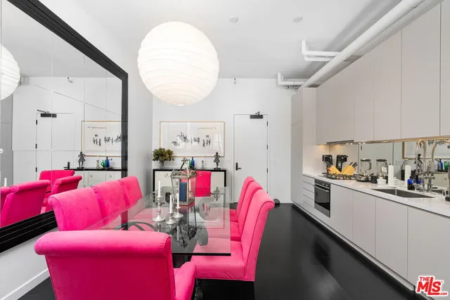 a living room with kitchen island granite countertop furniture and a sink