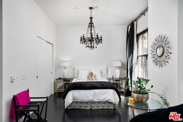 a bedroom with bed and window