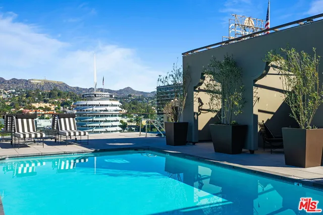 a view of a chairs and table in a balcony