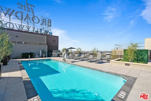 a view of a swimming pool with a patio