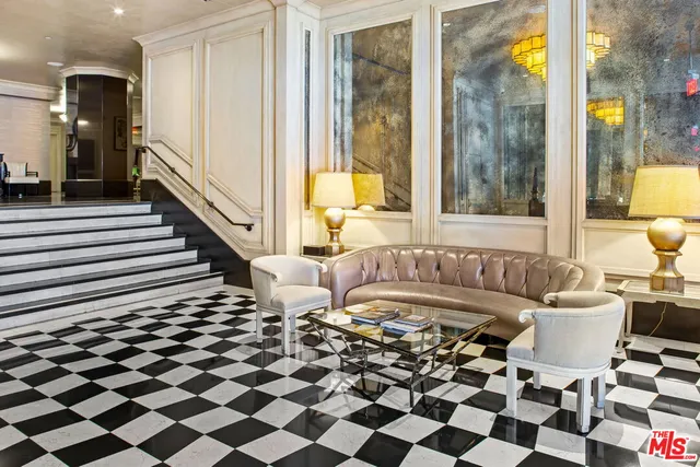 a living room with a black white checkered floor with a black white checkered floor