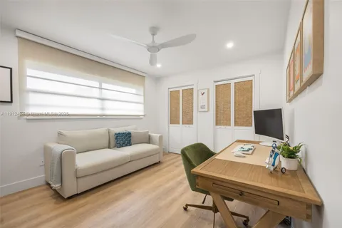 a workspace with furniture and a wooden floor