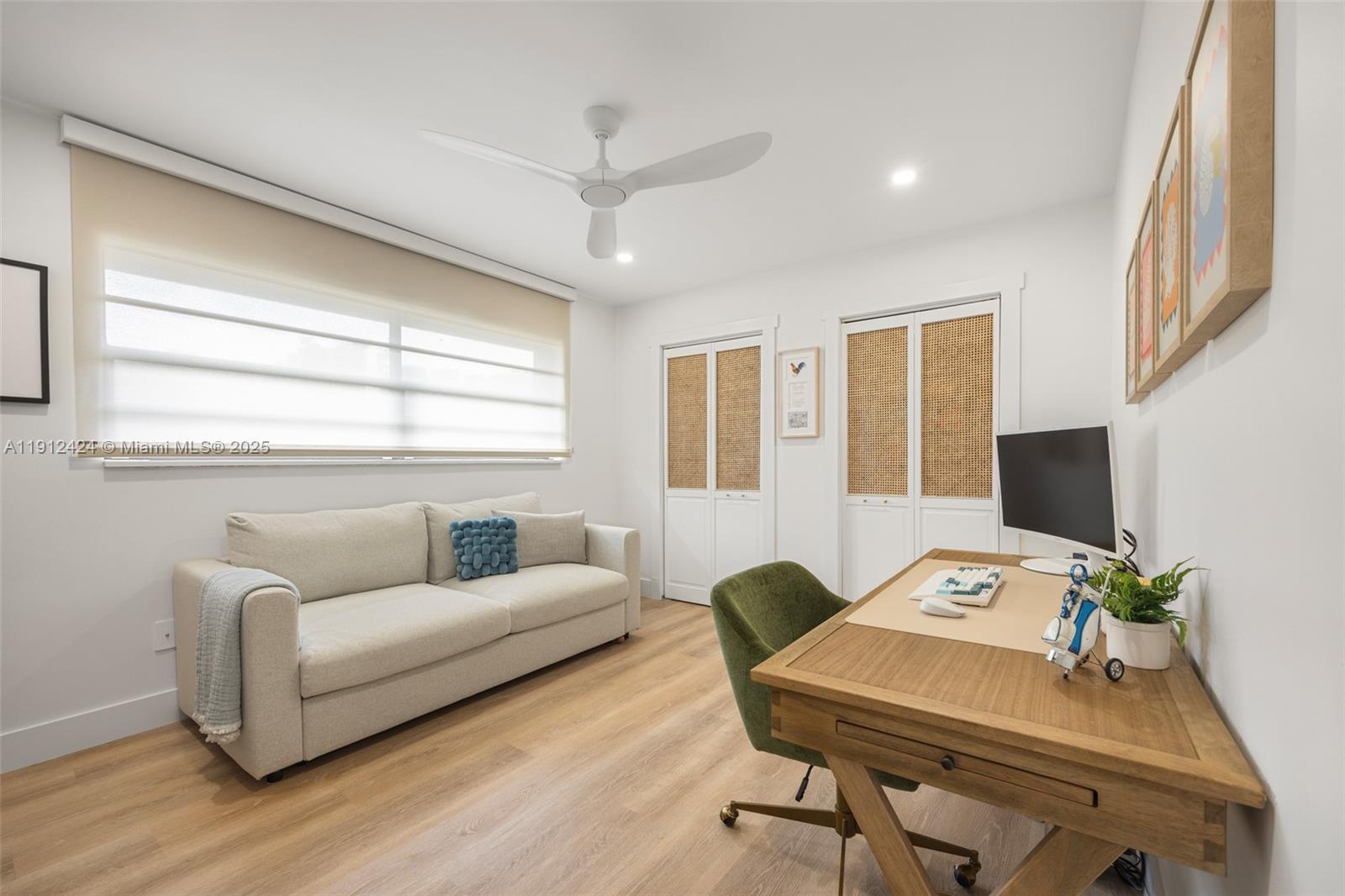 11537 Southwest 64th Street, Unit A83 Miami, FL 33173 - Photo 13 of 24 a workspace with furniture and a wooden floor