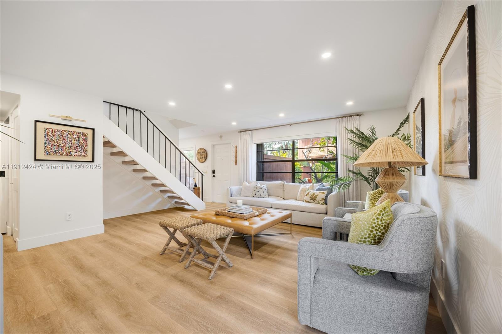 11537 Southwest 64th Street, Unit A83 Miami, FL 33173 - Photo 3 of 24 a living room with furniture and wooden floor