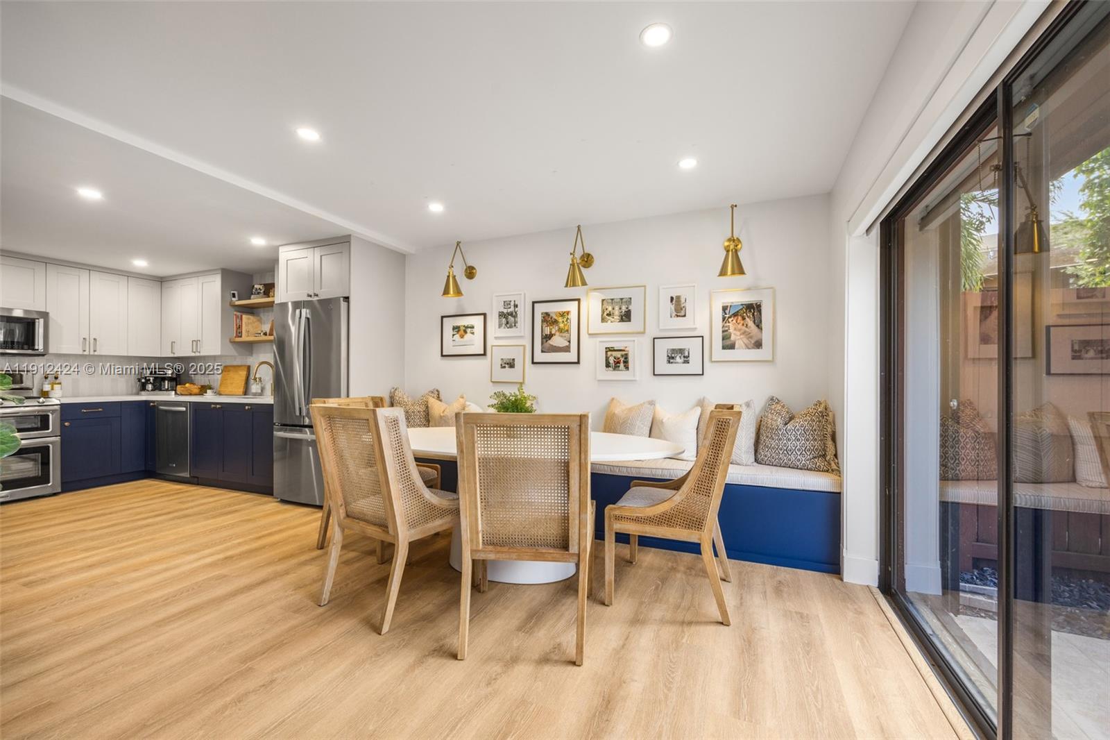 11537 Southwest 64th Street, Unit A83 Miami, FL 33173 - Photo 5 of 24 a view of a dining room with furniture and wooden floor