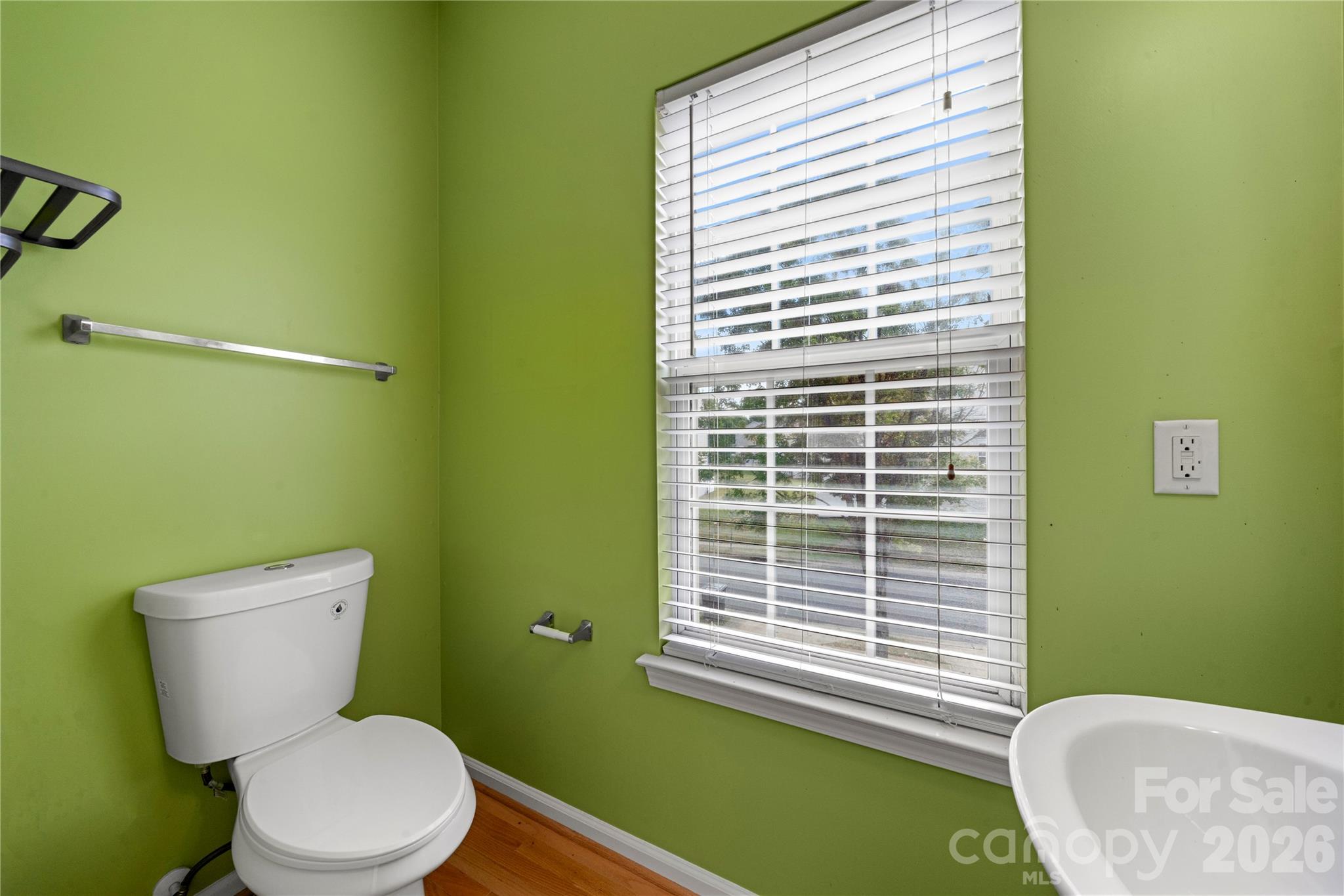 10213 Garrett Grigg Road Charlotte, NC 28262 - Photo 13 of 30 a bathroom with a toilet and a sink
