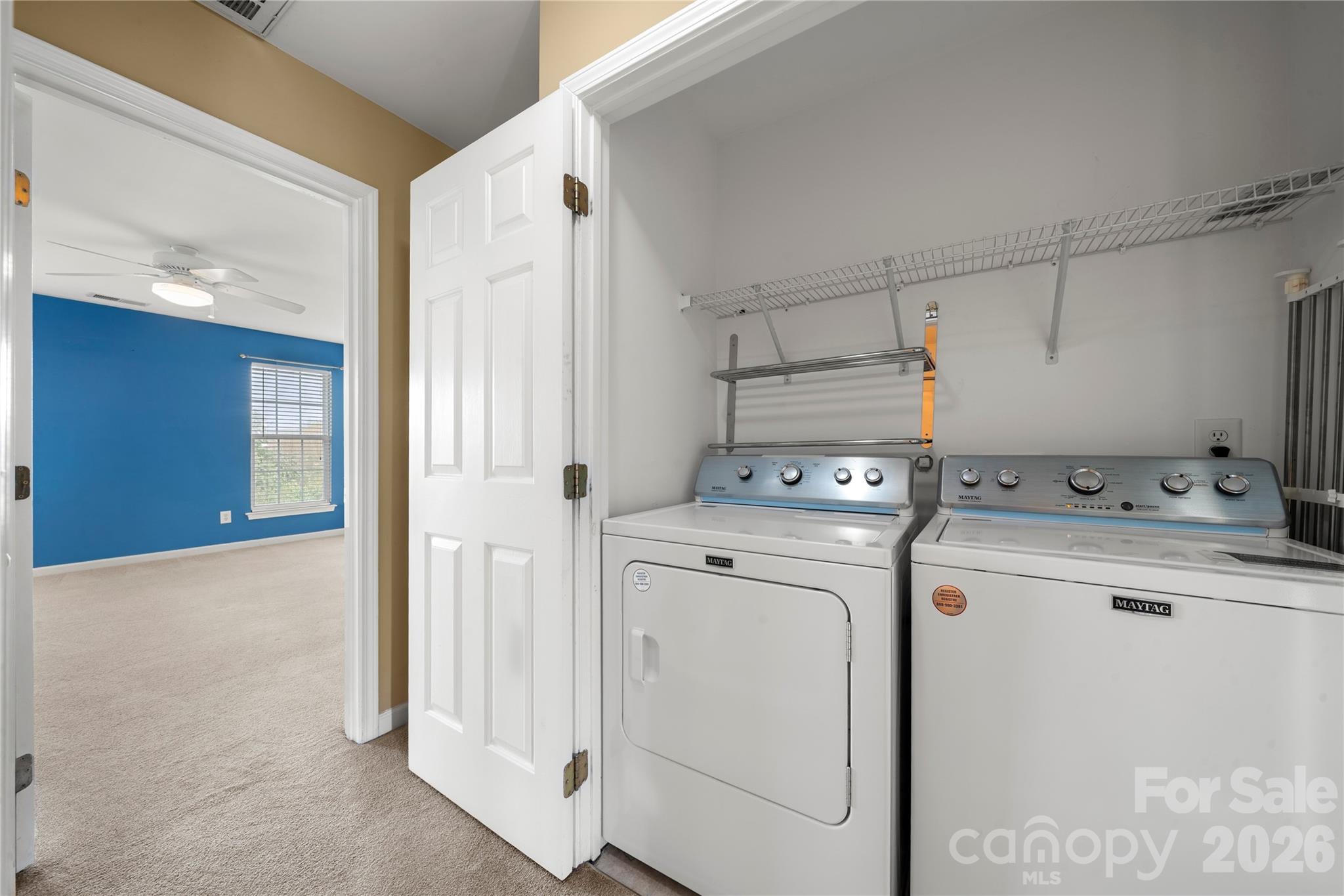 10213 Garrett Grigg Road Charlotte, NC 28262 - Photo 15 of 32 a view of a storage & utility room with dryer and washer