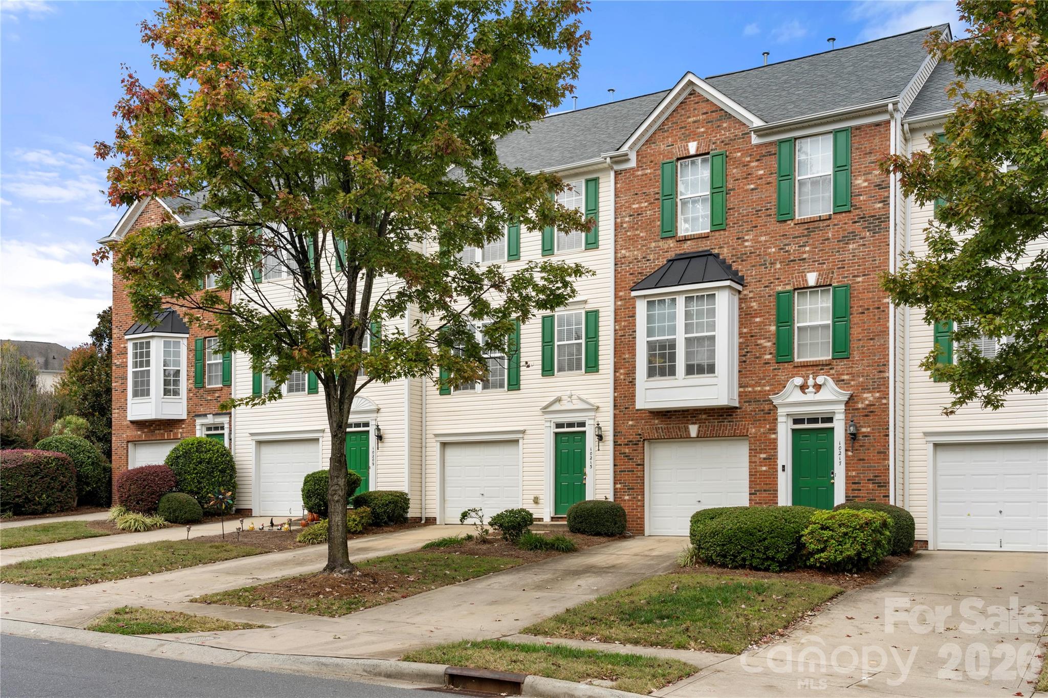 10213 Garrett Grigg Road Charlotte, NC 28262 - Photo 2 of 30 a front view of a house with garden