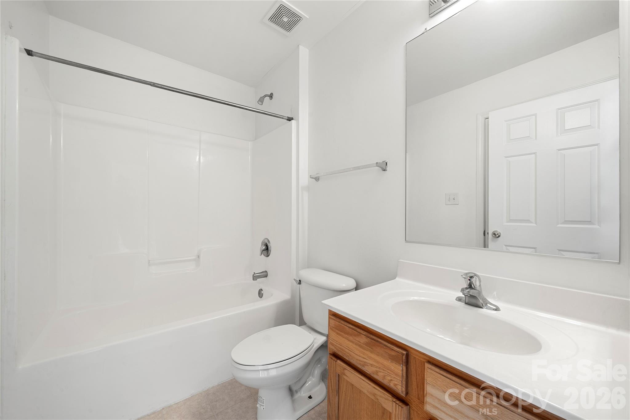 10213 Garrett Grigg Road Charlotte, NC 28262 - Photo 23 of 30 a bathroom with a sink toilet and shower