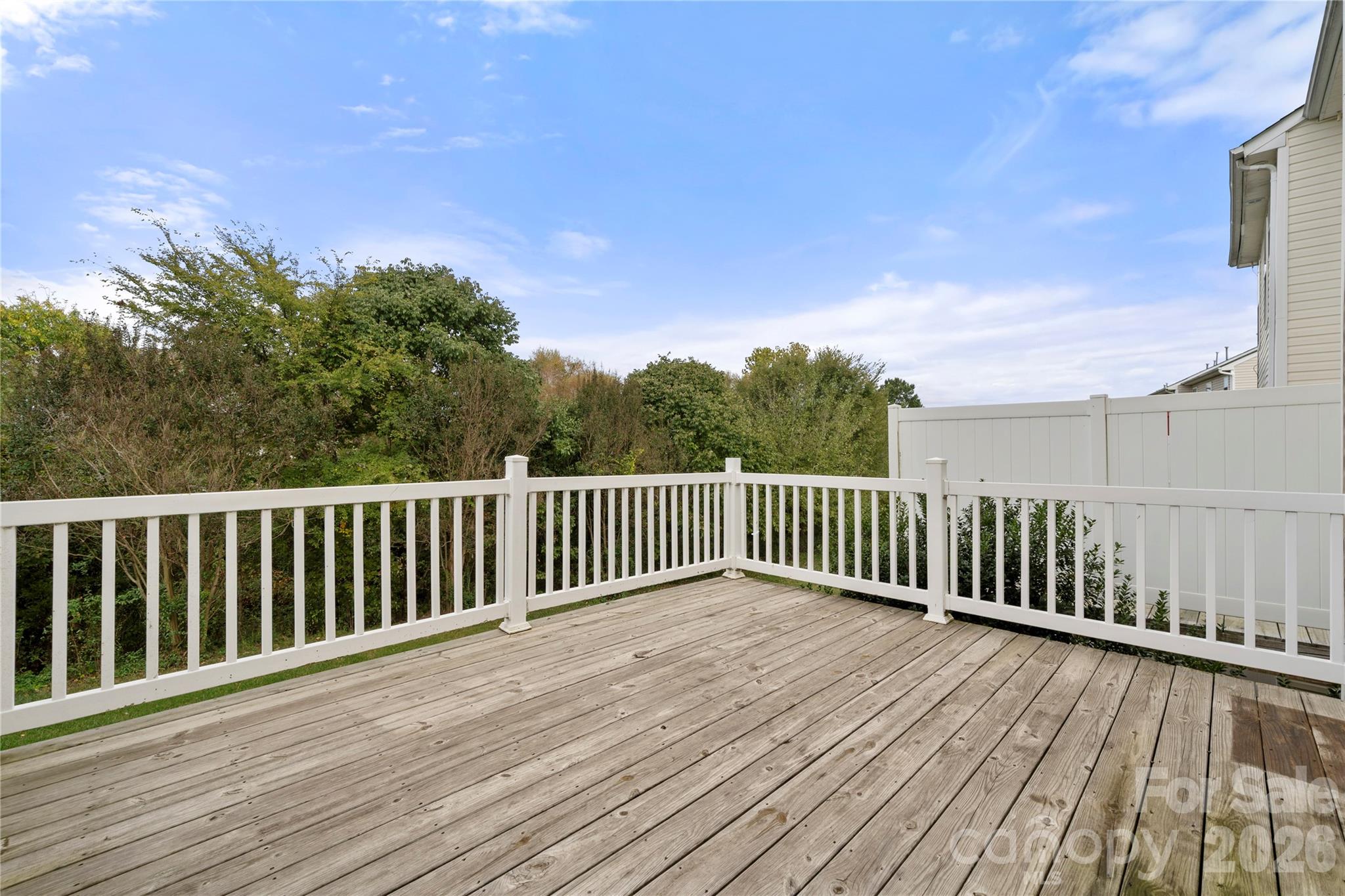 10213 Garrett Grigg Road Charlotte, NC 28262 - Photo 26 of 30 a view of balcony with wooden floor and fence