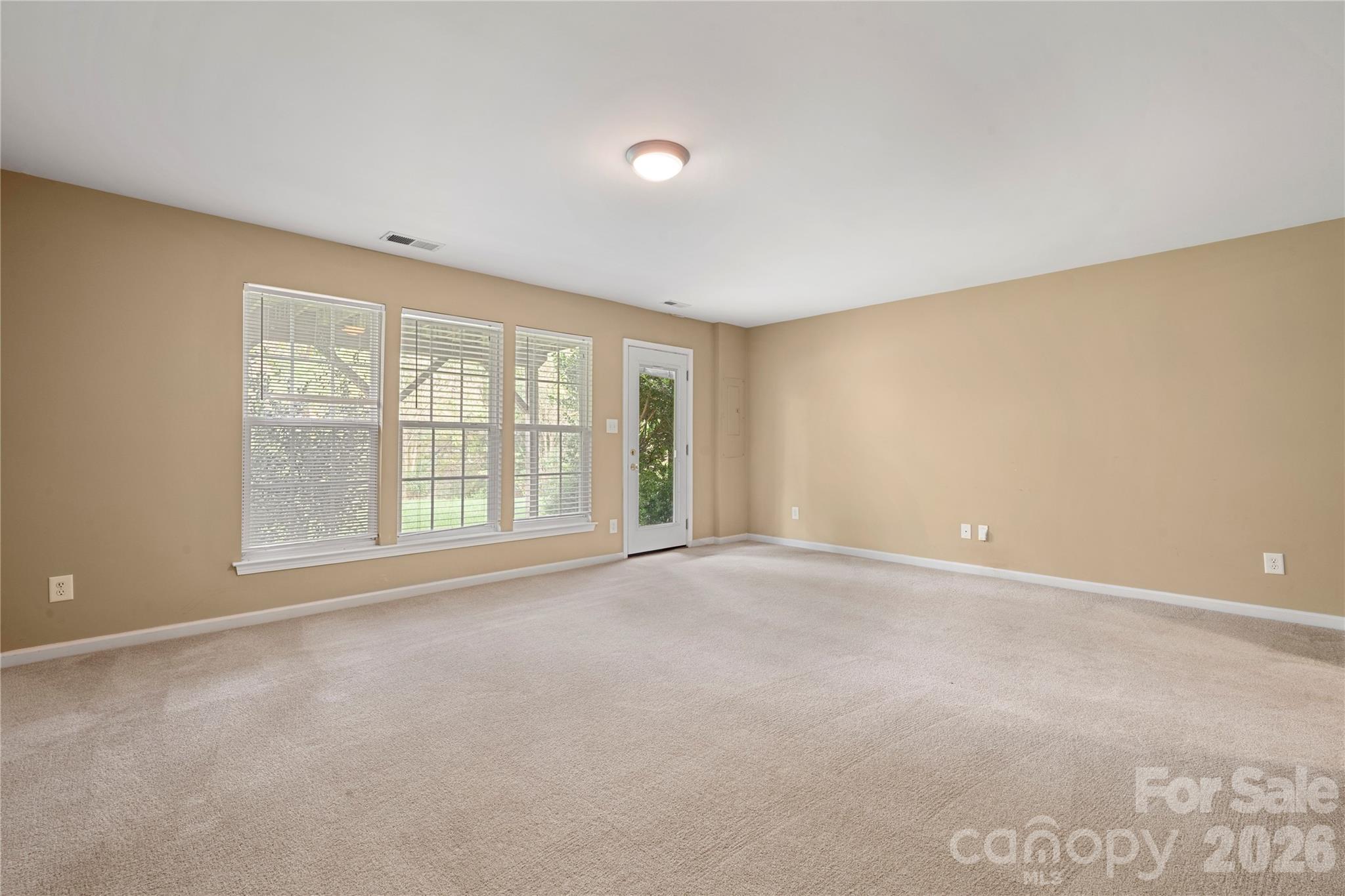 10213 Garrett Grigg Road Charlotte, NC 28262 - Photo 5 of 30 a view of an empty room with a window
