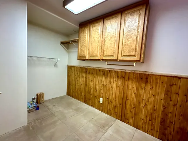a bathroom with a window and a bath tub