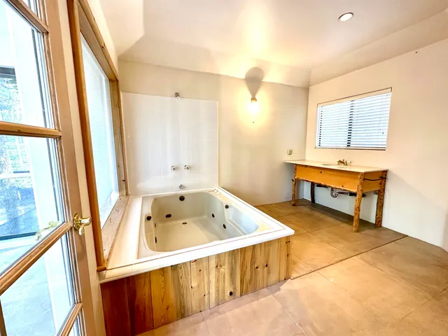a bathroom with a bathtub and a sink