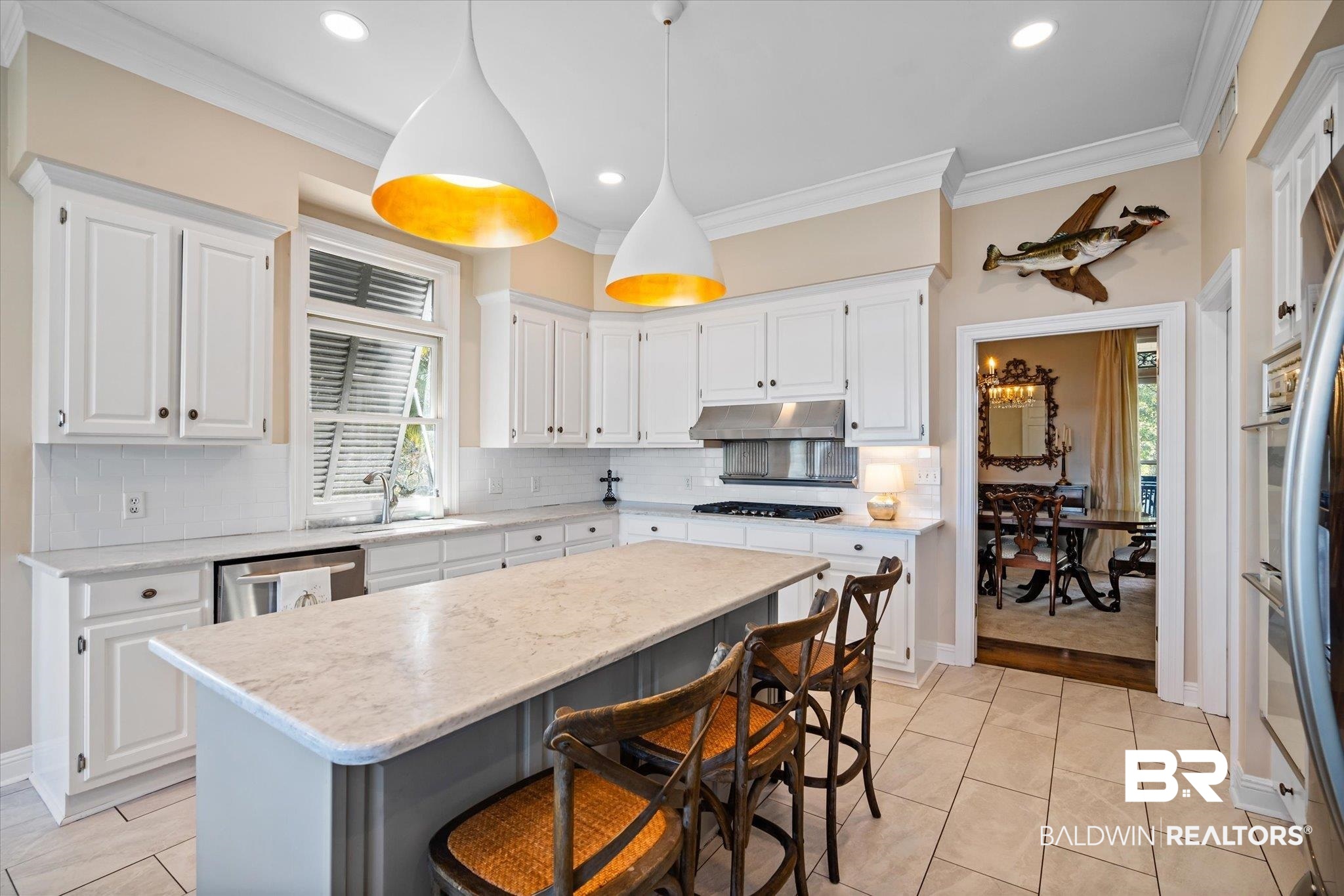 4930 River Trace Theodore, AL 36582 - Photo 10 of 57 Kitchen with a kitchen island, white cabinetry, hanging light fixtures, and plenty of natural light