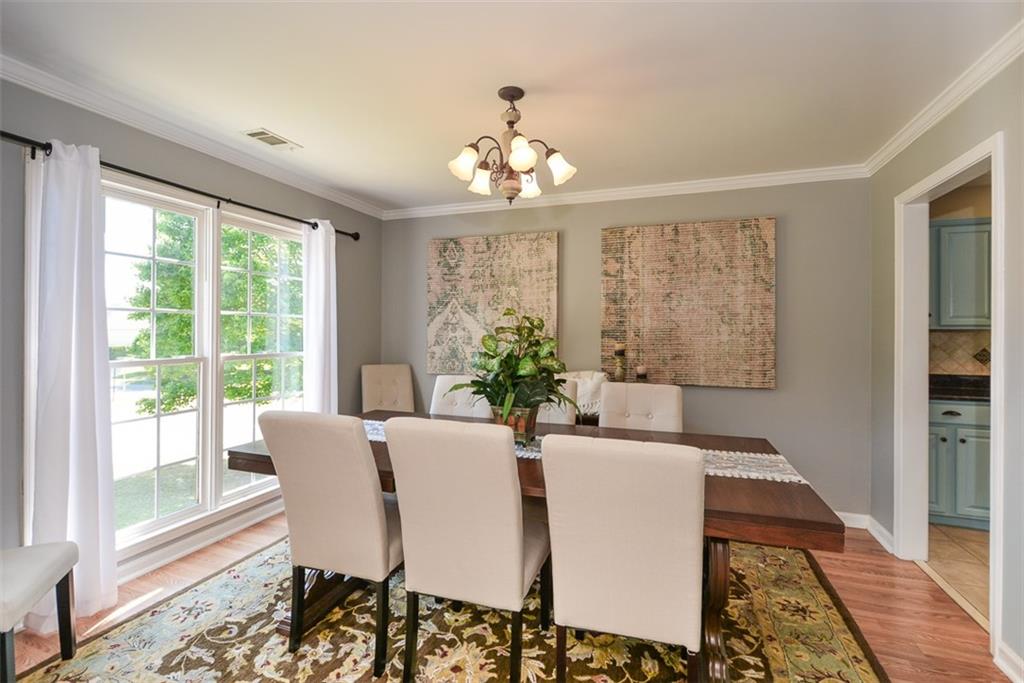 10 Arbor Hills Road South Talking Rock, GA 30175 - Photo 20 of 89 a dining room with furniture a chandelier and wooden floor