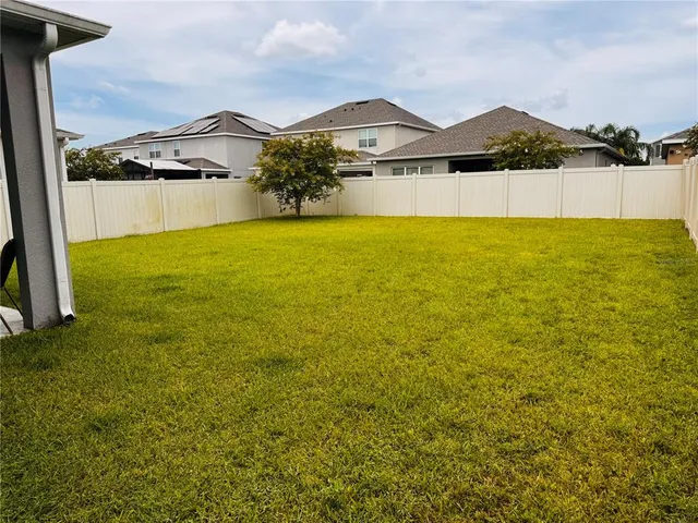 a view of a lake with a big yard