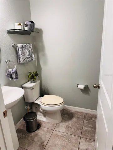a bathroom with a toilet and a sink