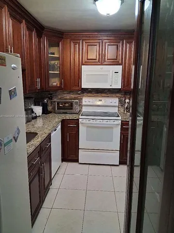 a kitchen with a stove and a sink