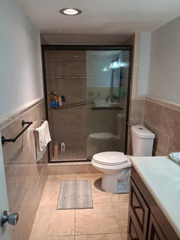 a bathroom with a toilet and a sink