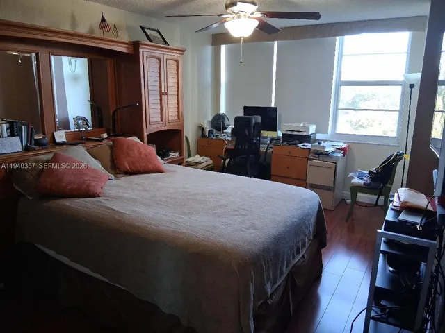 a bathroom with a glass shower door and a shower