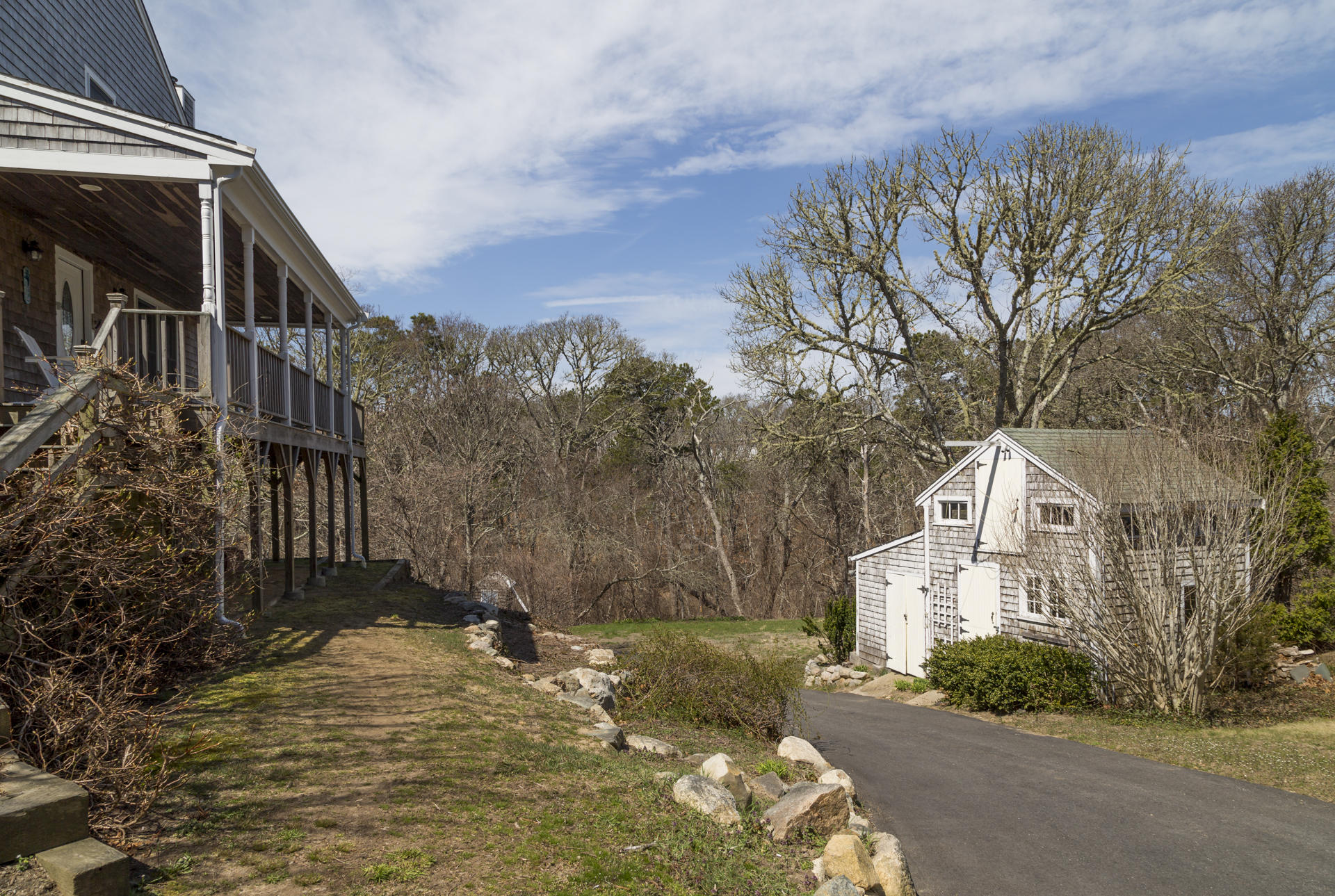 2118 Main Street Chatham, MA 02633 - Photo 2 of 33 a view of a white house with a yard covered with snow