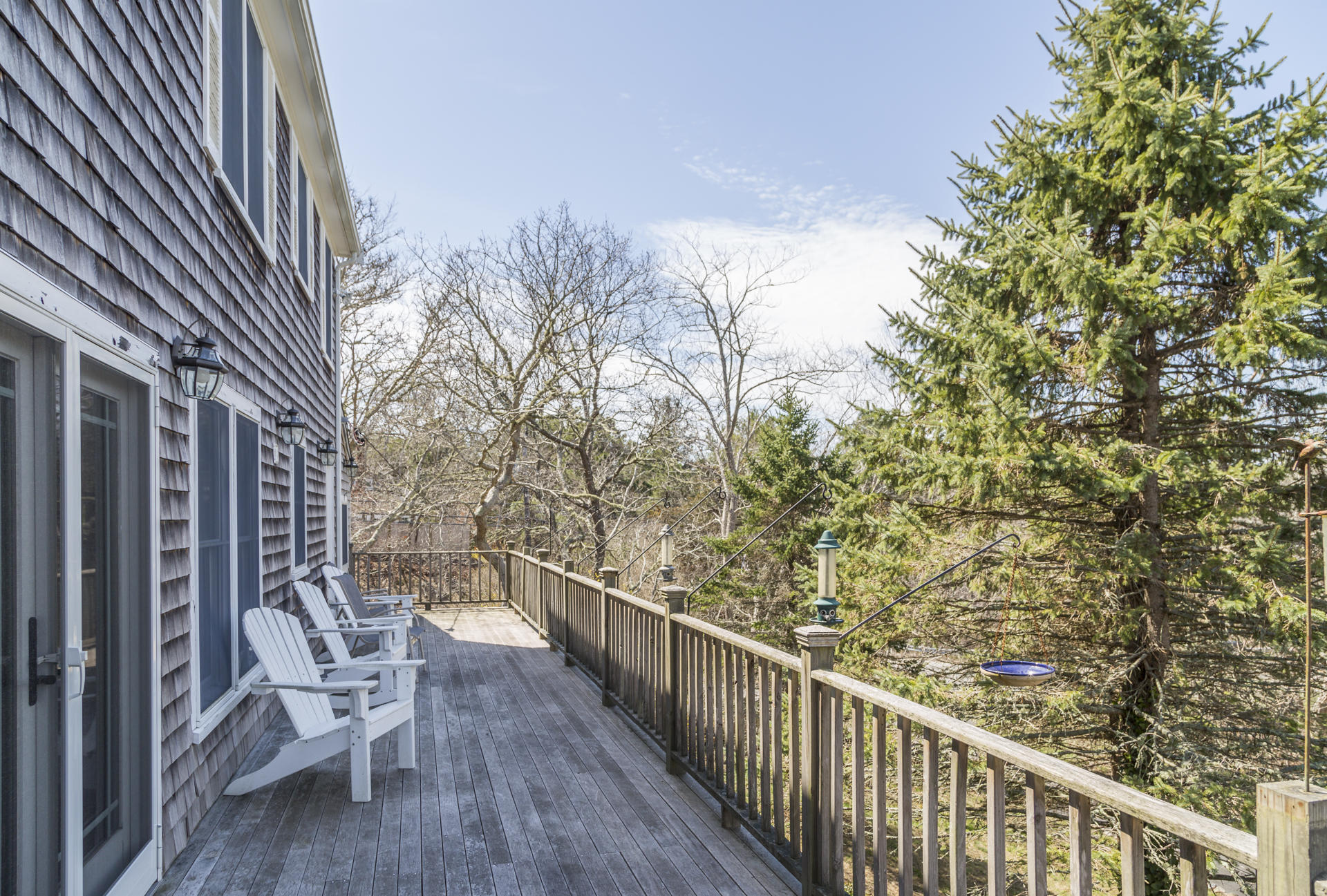 2118 Main Street Chatham, MA 02633 - Photo 33 of 33 a view of a balcony with chair and wooden fence
