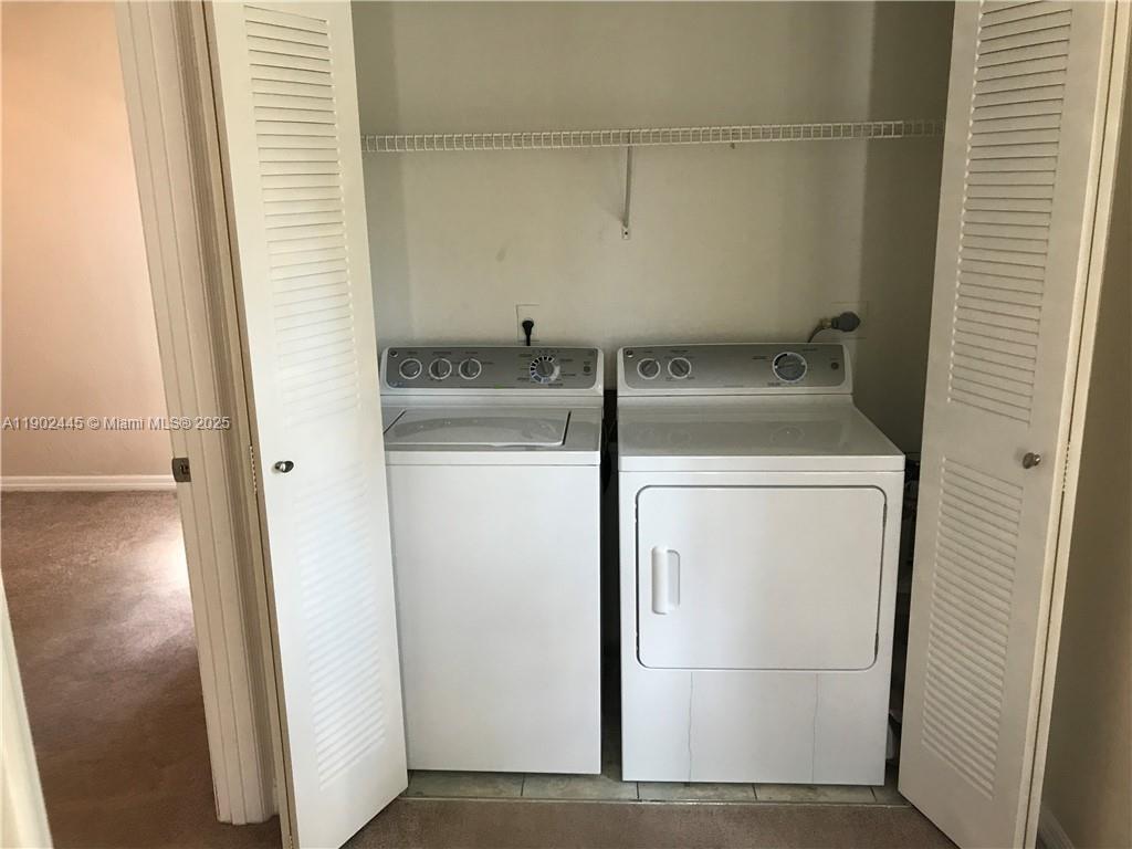 3470 Pinewalk Drive North, Unit 224 Margate, FL 33063 - Photo 14 of 24 a utility room with dryer and washer