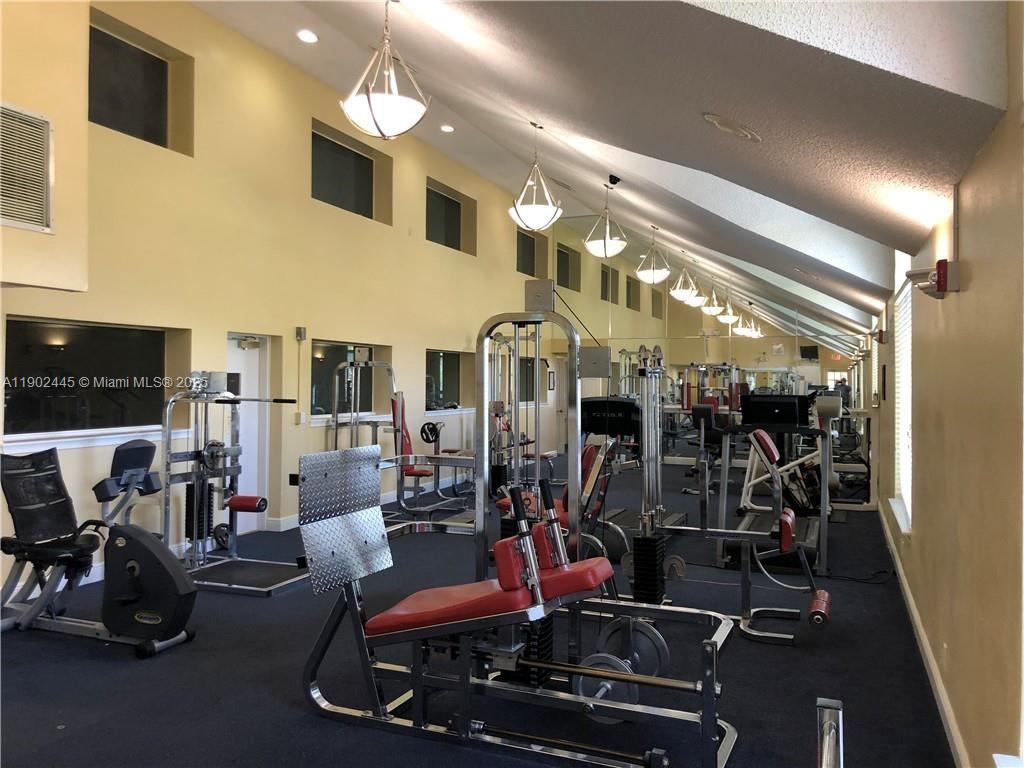 3470 Pinewalk Drive North, Unit 224 Margate, FL 33063 - Photo 20 of 24 a room with gym equipment