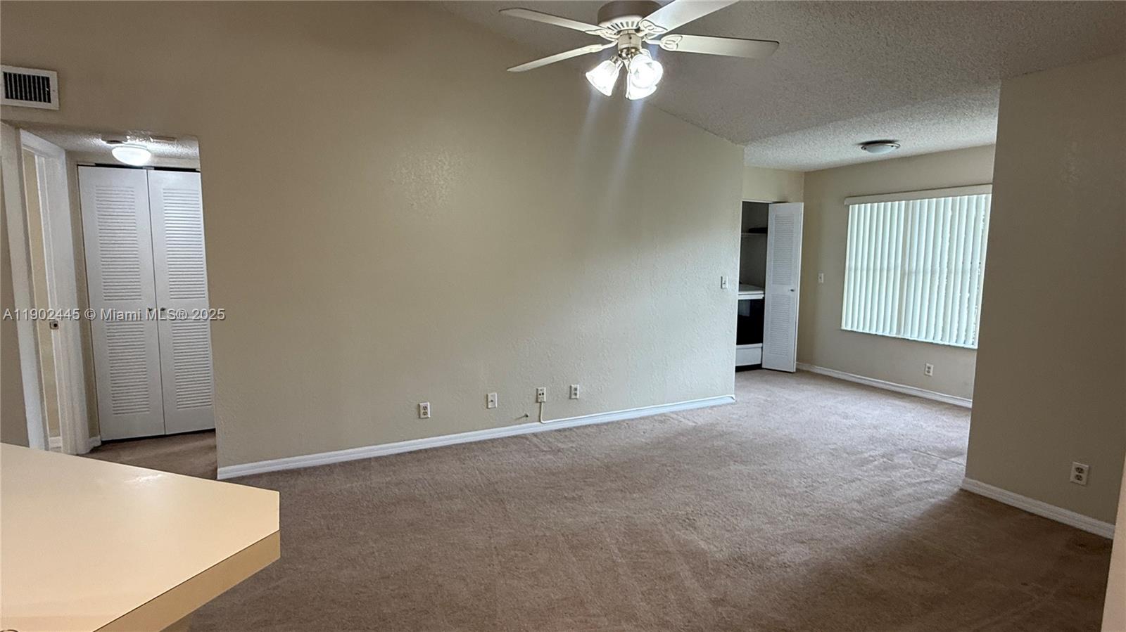 3470 Pinewalk Drive North, Unit 224 Margate, FL 33063 - Photo 6 of 24 a view of an empty room with a window