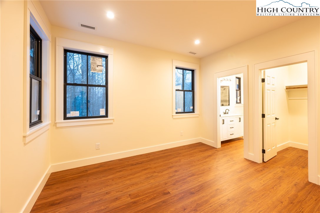 131 Bryce Way Boone, NC 28607 - Photo 18 of 38 wooden floor in an empty room with a window