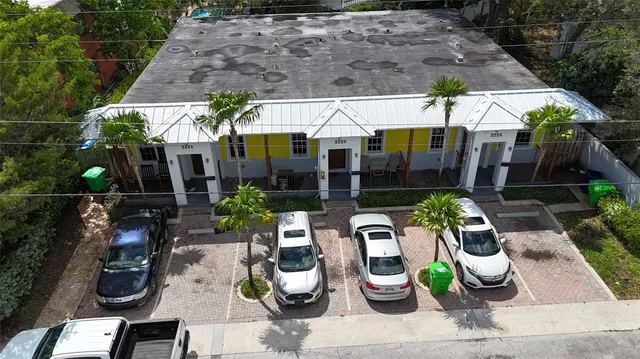 an outdoor space with lots of potted plants