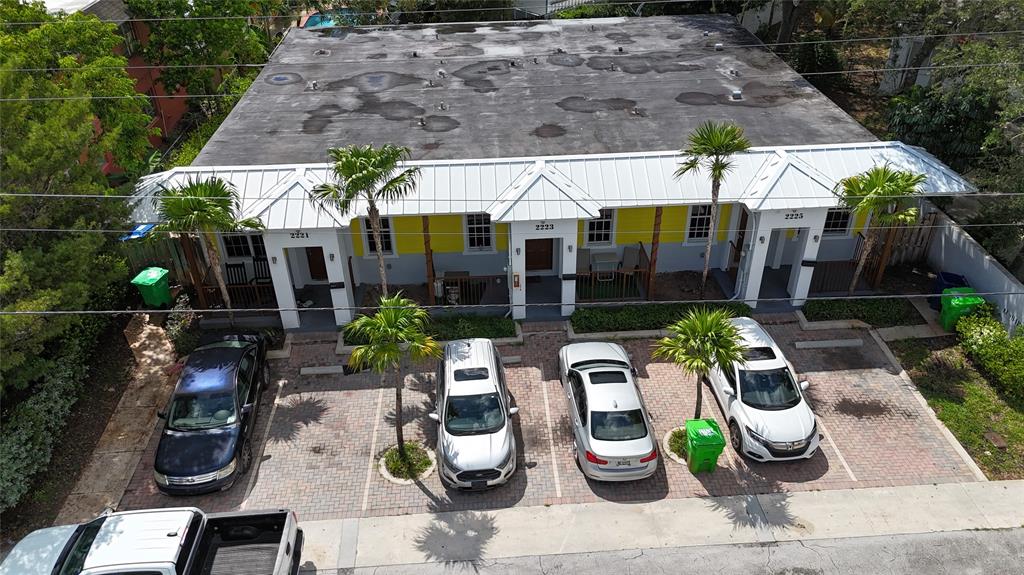 an outdoor space with lots of potted plants