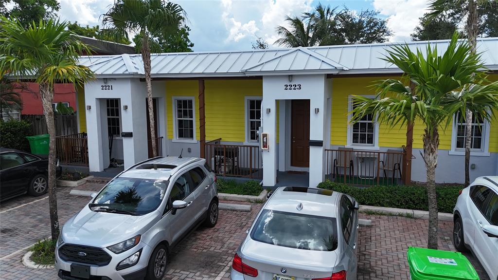 2221 Northwest 64th Avenue Sunrise, FL 33313 - Photo 2 of 3 a car parked in front of a house
