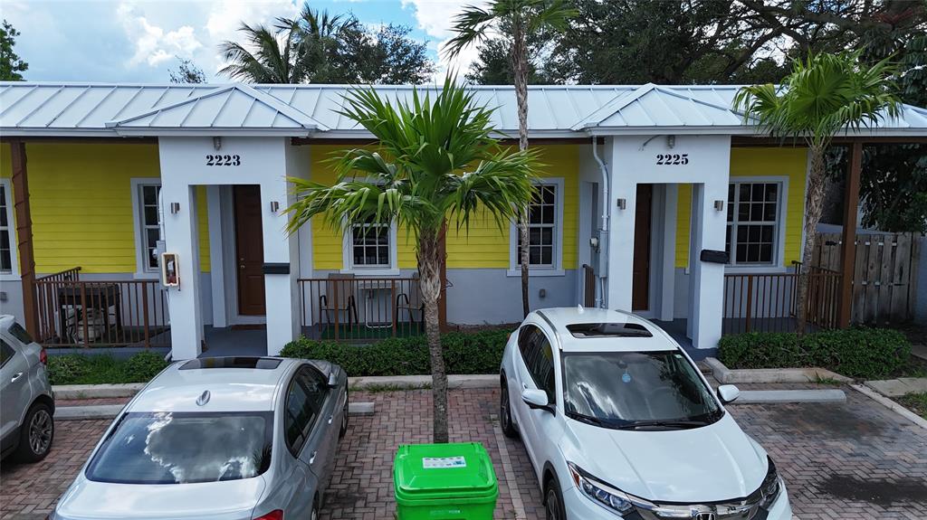 2221 Northwest 64th Avenue Sunrise, FL 33313 - Photo 3 of 3 a front view of house with yard outdoor seating and barbeque oven