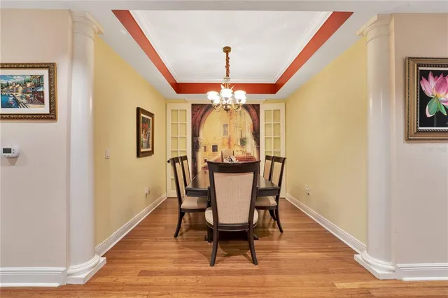 a view of a dining room with furniture and wooden floor