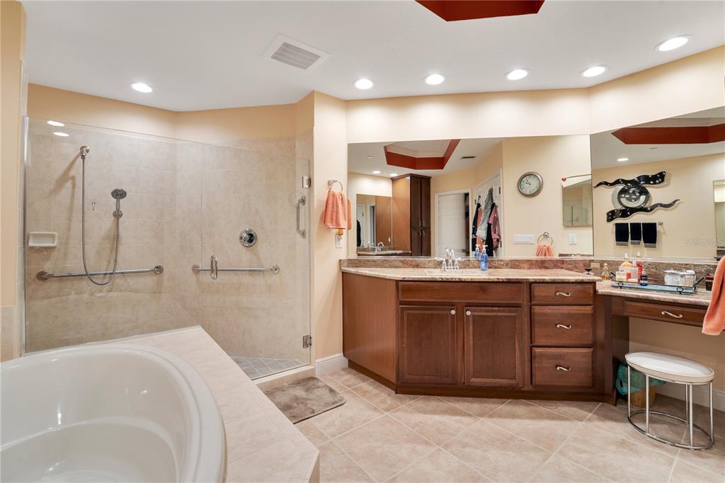 6350 Water Crest Way, Unit 203 Lakewood Ranch, FL 34202 - Photo 18 of 45 a spacious bathroom with a large tub shower and sink