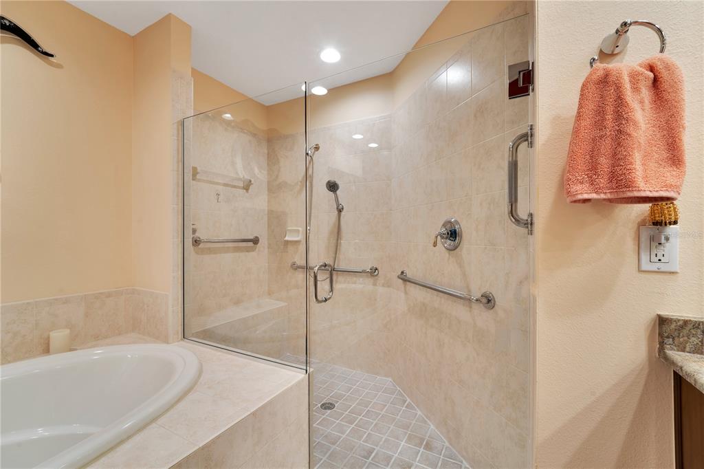 6350 Water Crest Way, Unit 203 Lakewood Ranch, FL 34202 - Photo 19 of 45 a bathroom with a shower and a tub