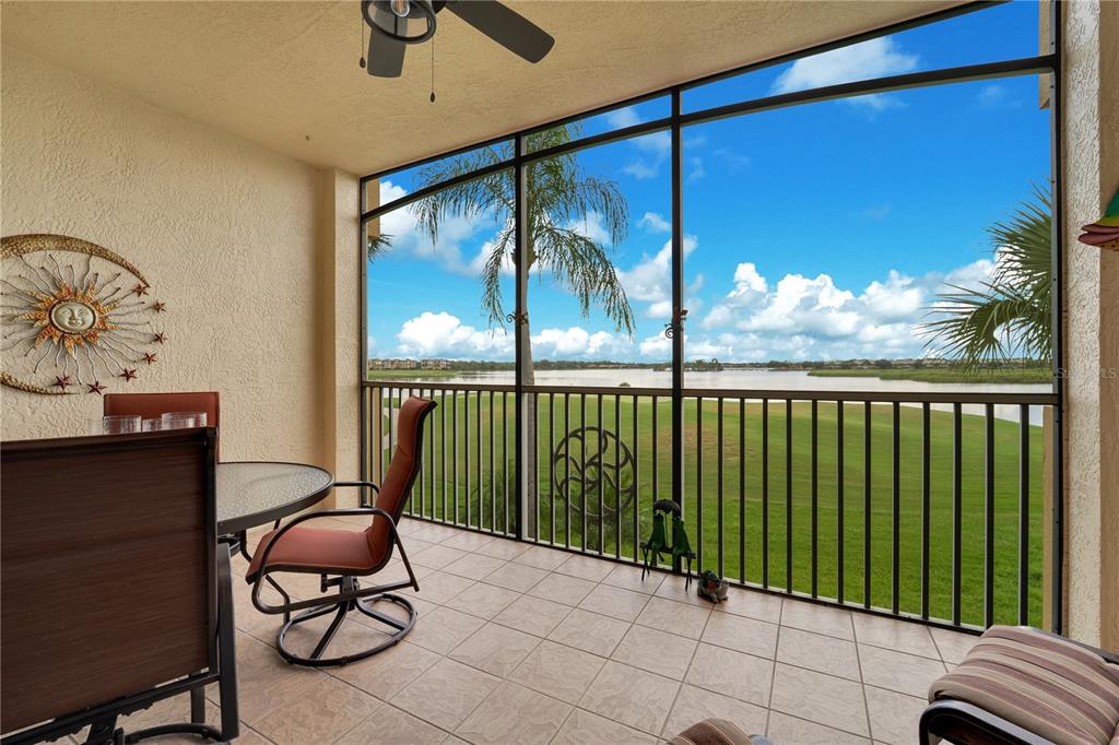 6350 Water Crest Way, Unit 203 Lakewood Ranch, FL 34202 - Photo 25 of 45 a bedroom with furniture and a window