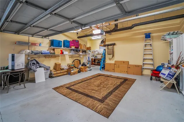 a living room with lots of furniture and gym equipment